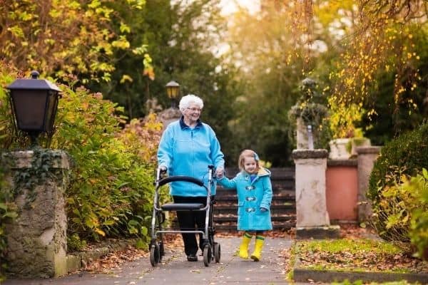 Child and elderly using rollator