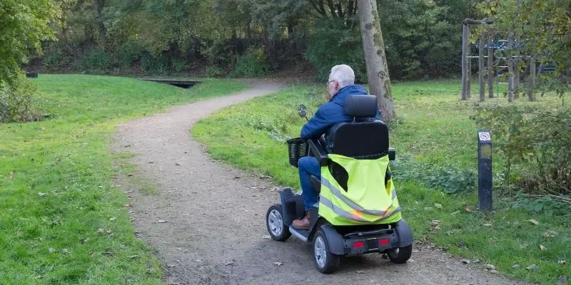 Elderly traveling on a mobility scooter