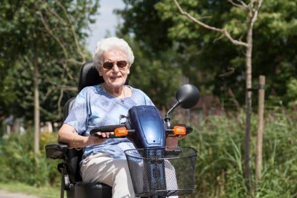 Elderly woman on a mobility scooter