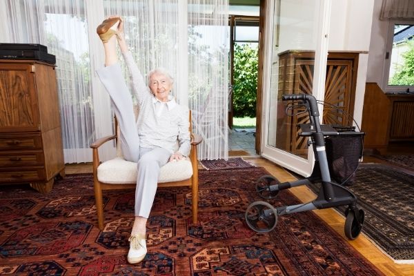Elderly woman doing a flexibility exercise