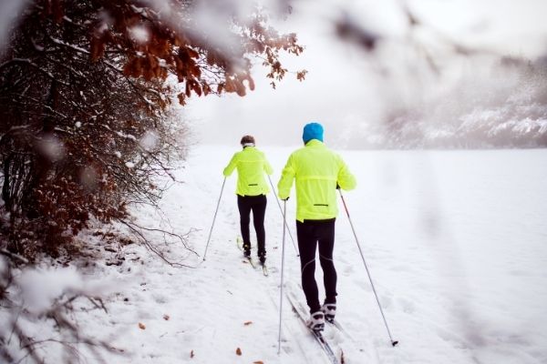 Elderly people cross country skiing