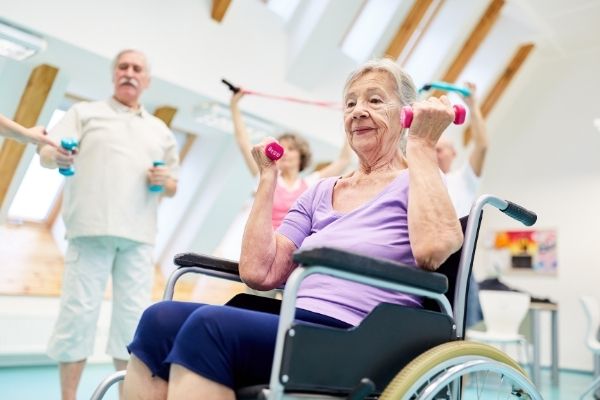 Senior doing lift exercise on wheelchair